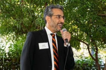 nader nadershahi speaks into a microphone